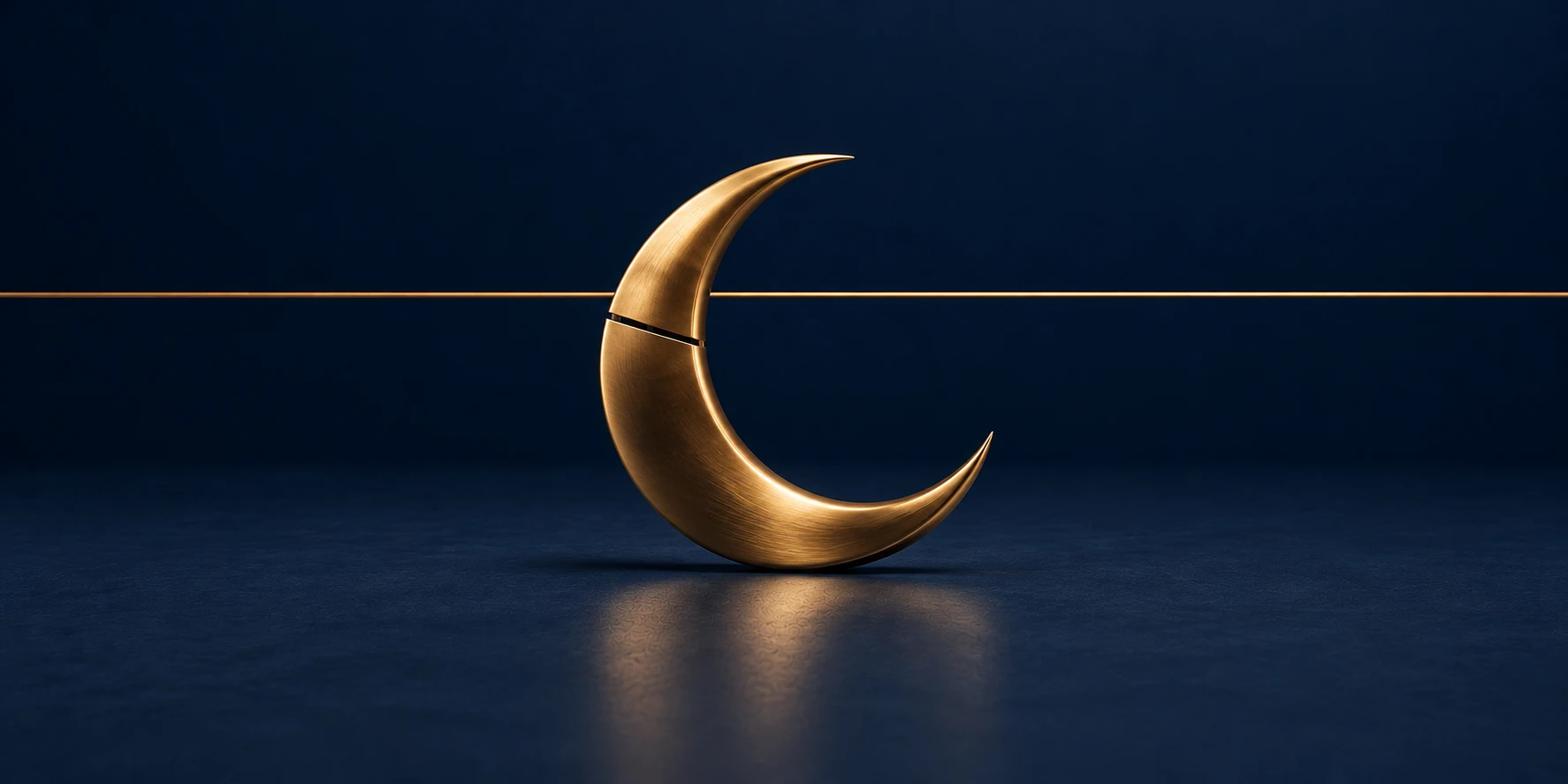 A gold crescent moon sculpture on a navy surface, with a thin hairline gap running through its curve.